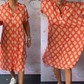 Damenkleid mit Revers, kurzen Ärmeln, Print und Schlitz am Saum