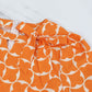 Trendiges orangefarbenes bedrucktes Damenkleid mit 3/4-Ärmeln