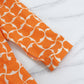 Trendiges orangefarbenes bedrucktes Damenkleid mit 3/4-Ärmeln